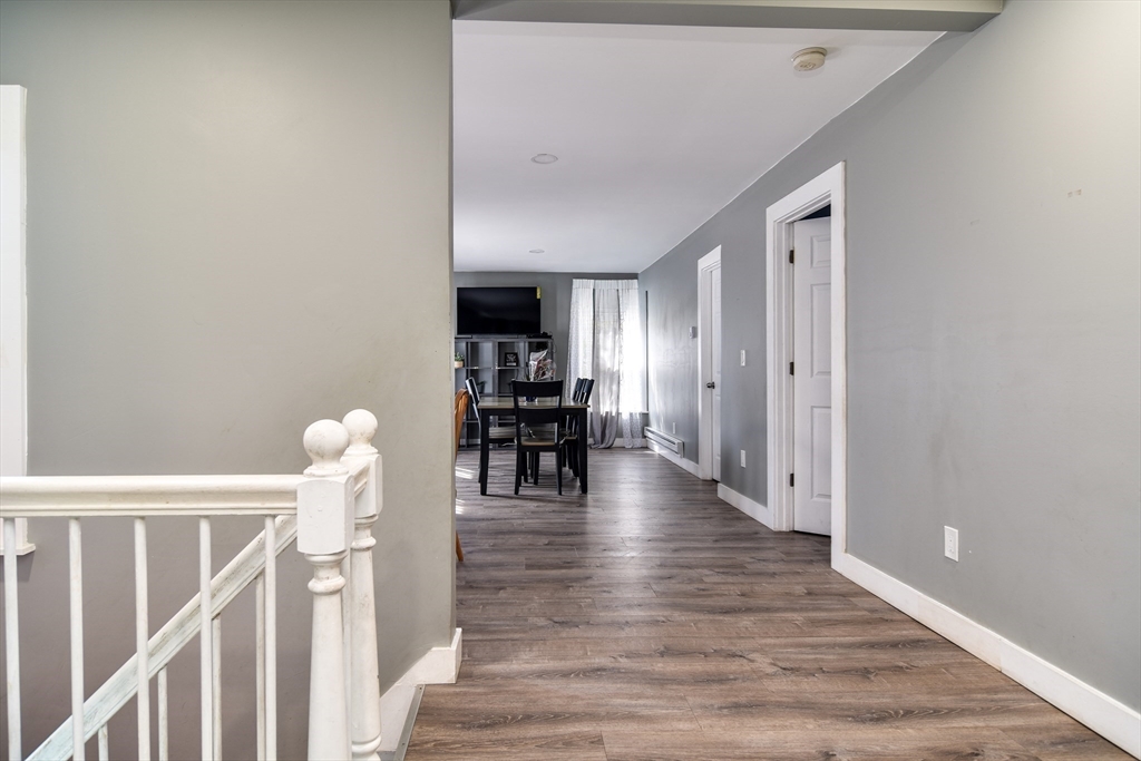 136 Commonwealth Road Wayland, MA 01778 - Photo 3 of 27 a view of entryway and hall with wooden floor