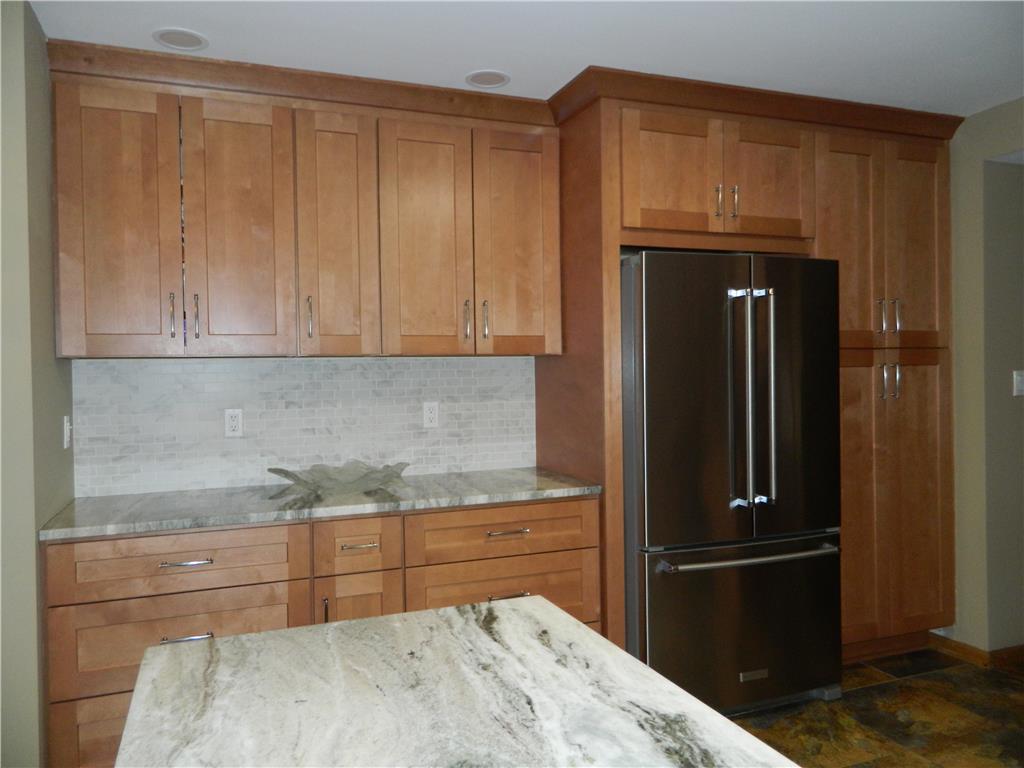 328 Pin Oak Road Stroudsburg, PA 18360 - Photo 16 of 37 Culinary aspirations come alive in this kitchen with rich wood cabinetry and ample counter space.