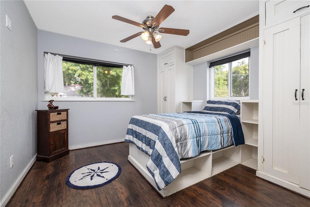 1709 Umbrella Tree Drive Edgewater, FL 32132 - Photo 17 of 37 a bedroom with a bed and a table