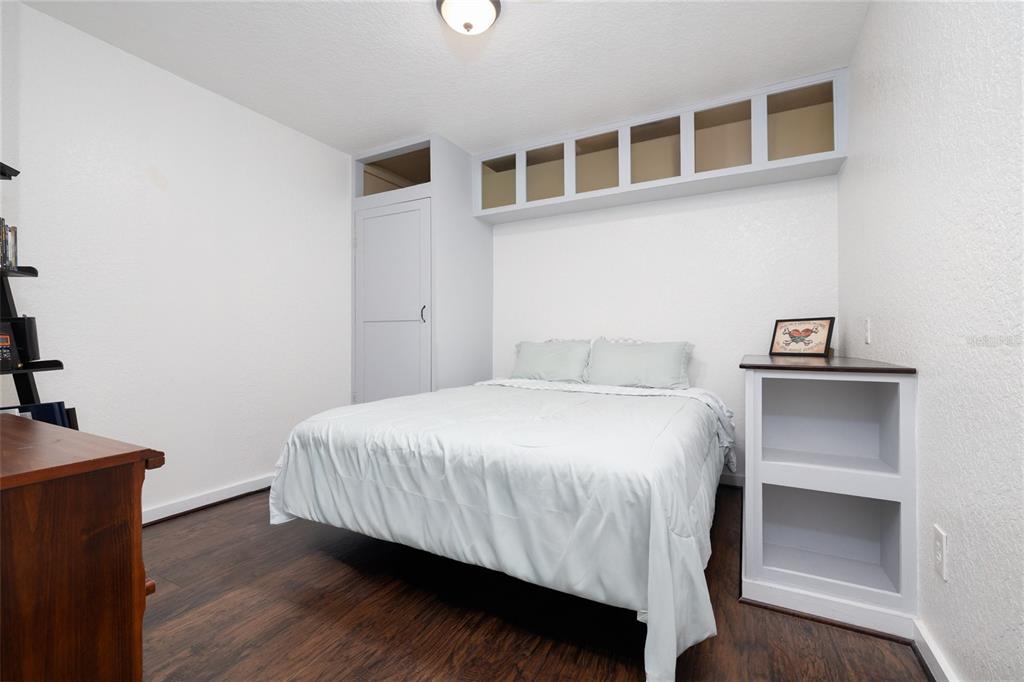 1709 Umbrella Tree Drive Edgewater, FL 32132 - Photo 18 of 37 a bedroom with a bed and a night stand