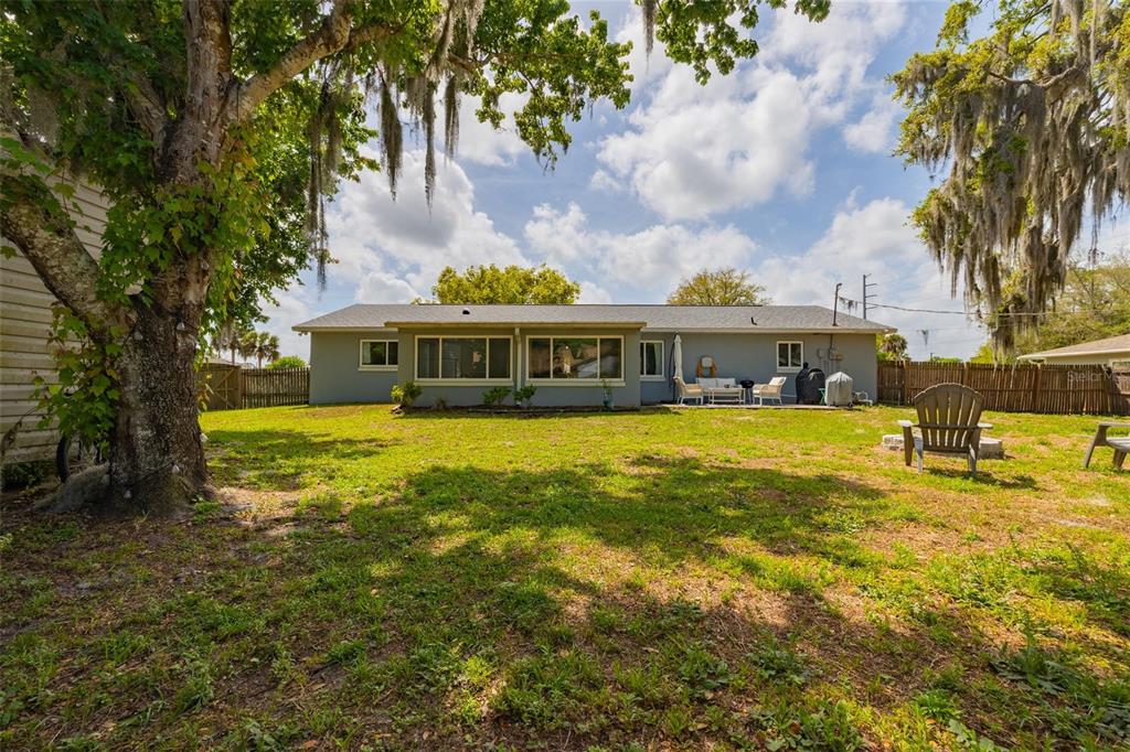 1709 Umbrella Tree Drive Edgewater, FL 32132 - Photo 20 of 37 a view of a house with swimming pool