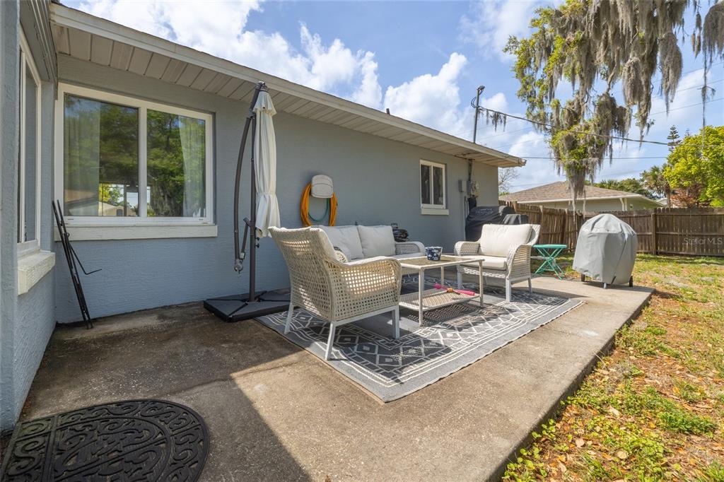 1709 Umbrella Tree Drive Edgewater, FL 32132 - Photo 21 of 37 a outdoor space with a couch and chairs