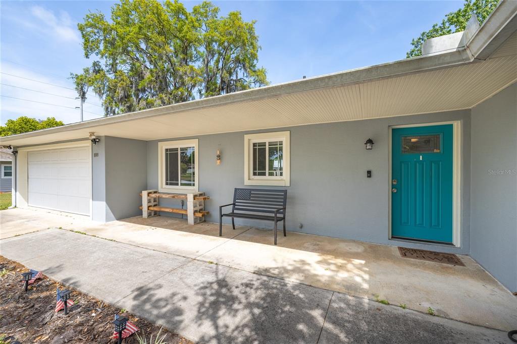 1709 Umbrella Tree Drive Edgewater, FL 32132 - Photo 4 of 37 a view of a house with chairs in the patio