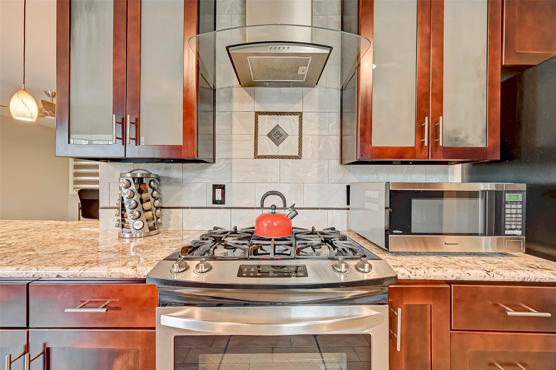 6119 Reamer Street Houston, TX 77074 - Photo 13 of 33 a kitchen with stainless steel appliances granite countertop a stove and cabinets