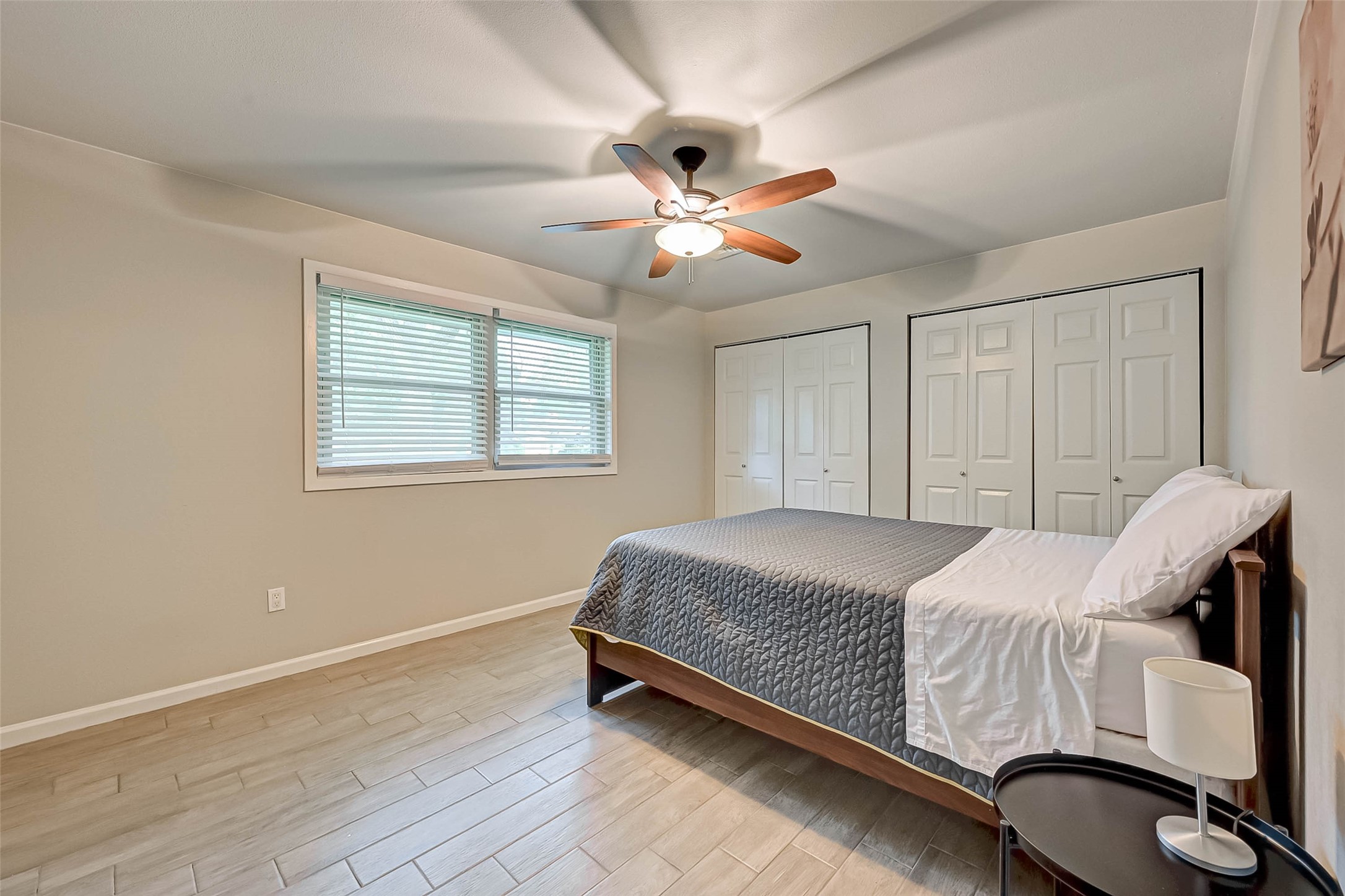 6119 Reamer Street Houston, TX 77074 - Photo 23 of 33 a bedroom with a bed and a chandelier