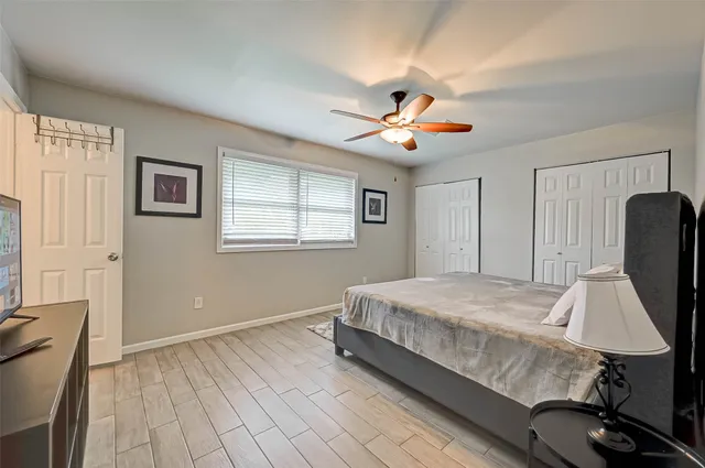 a bedroom with bed and window