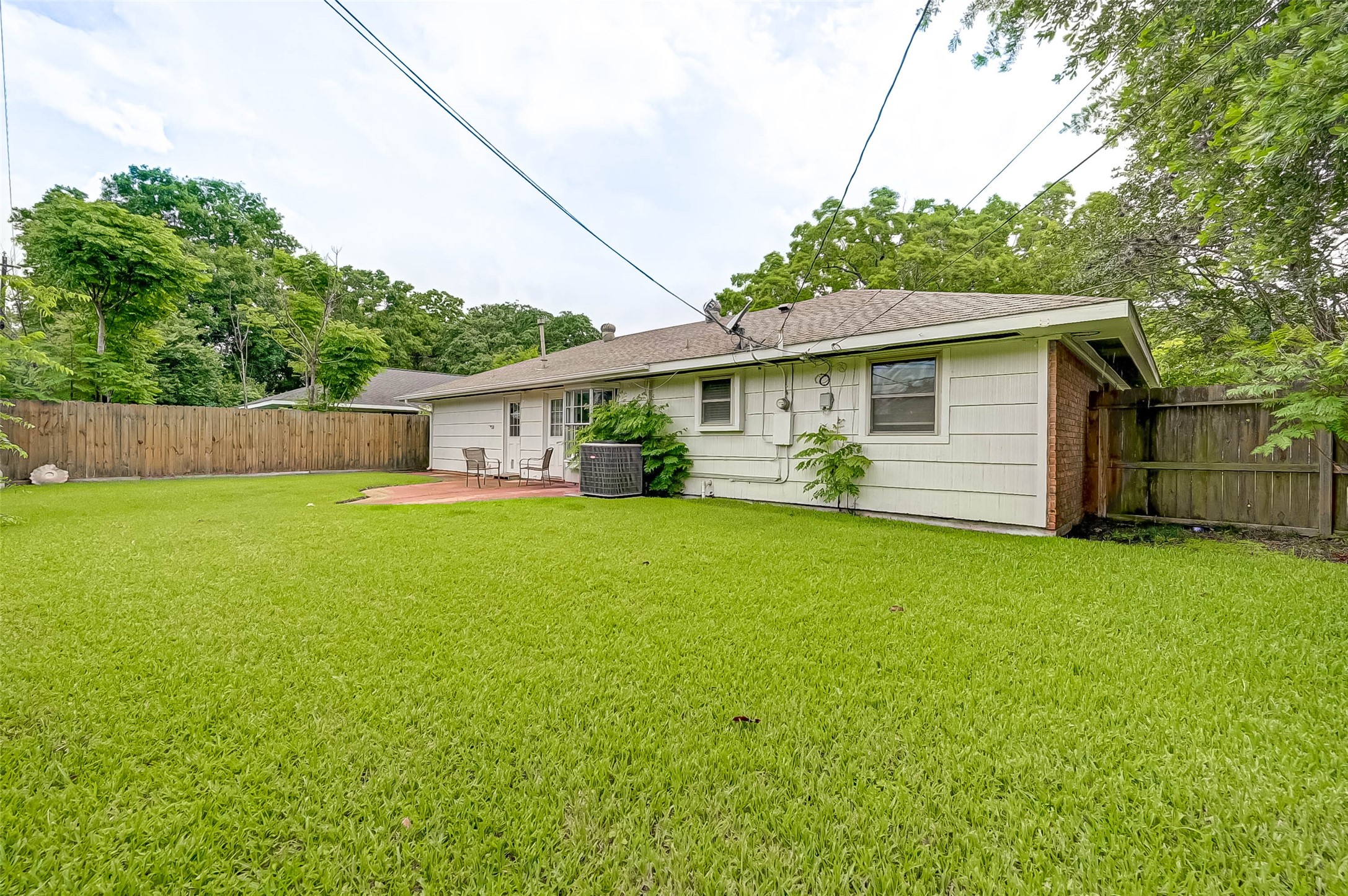 6119 Reamer Street Houston, TX 77074 - Photo 32 of 33 a front view of house with yard and green space