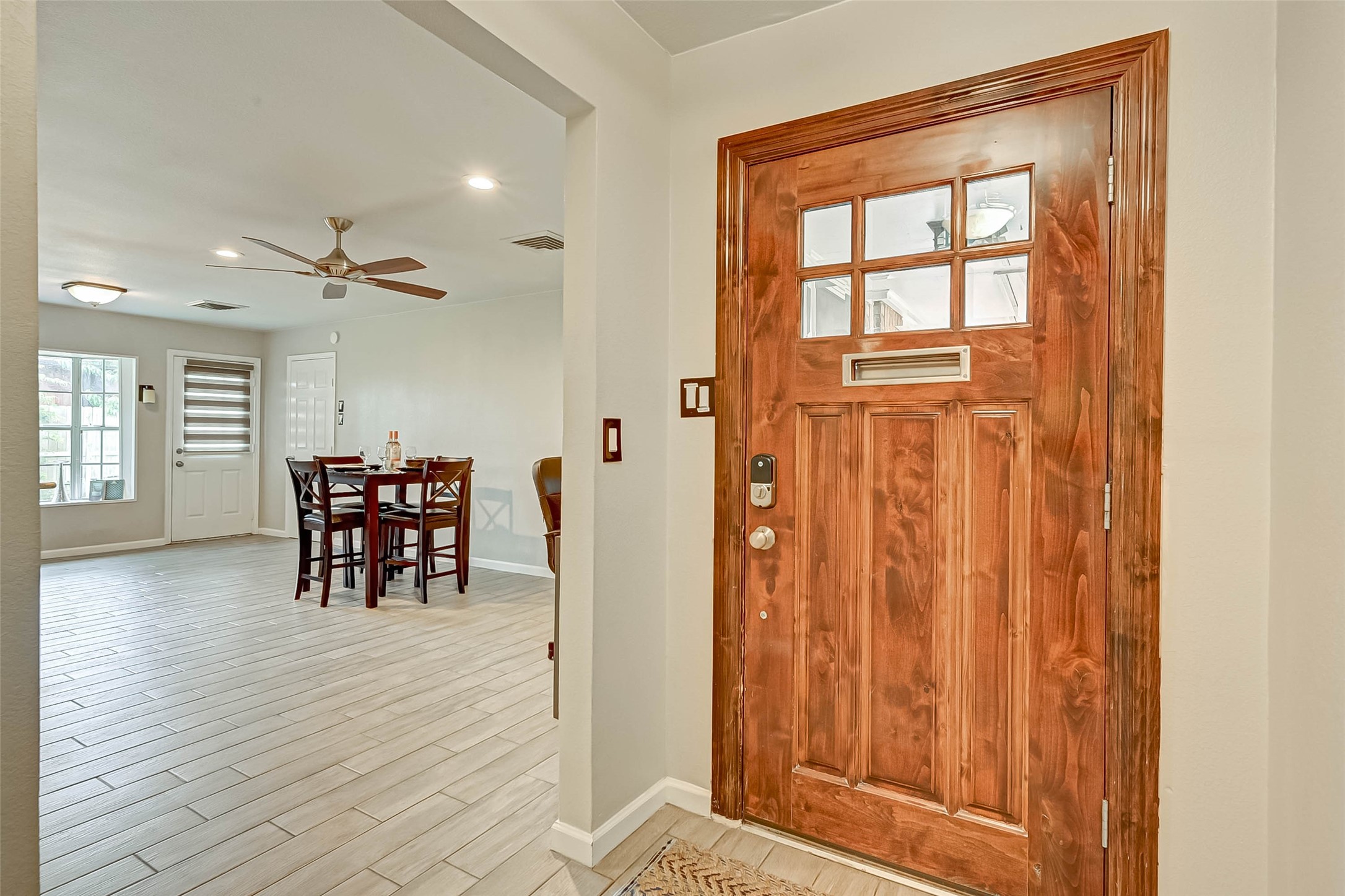 6119 Reamer Street Houston, TX 77074 - Photo 5 of 33 wooden floor in an empty room with a window