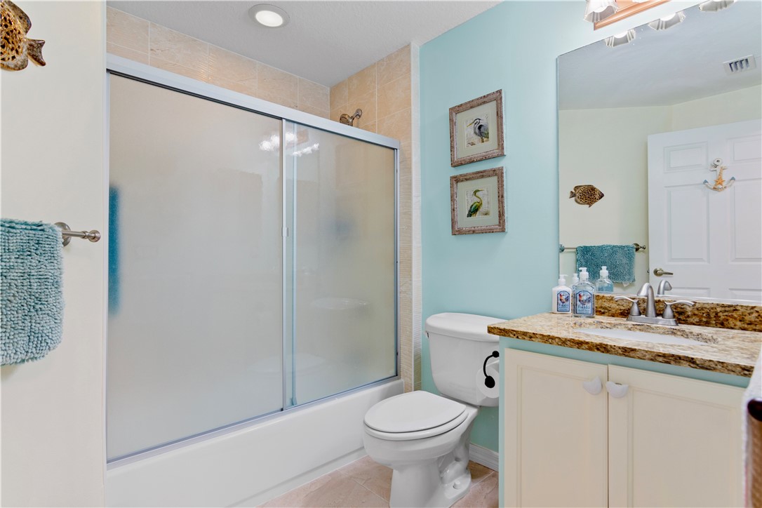 528 7th Square Southwest, Unit 102 Vero Beach, FL 32962 - Photo 15 of 28 a bathroom with a sink toilet and shower