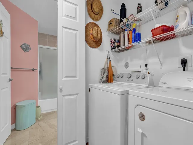 a view of storage and utility room with washer and dryer