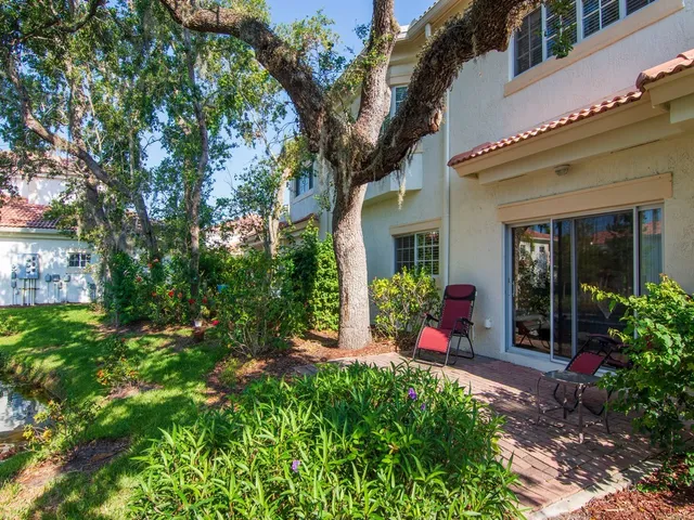 a view of a lake with a house in the background