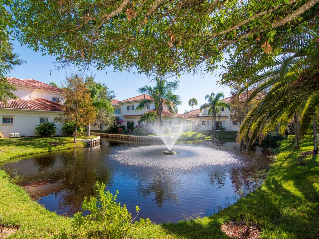 528 7th Square Southwest, Unit 102 Vero Beach, FL 32962 - Photo 20 of 28 a view of a lake with houses