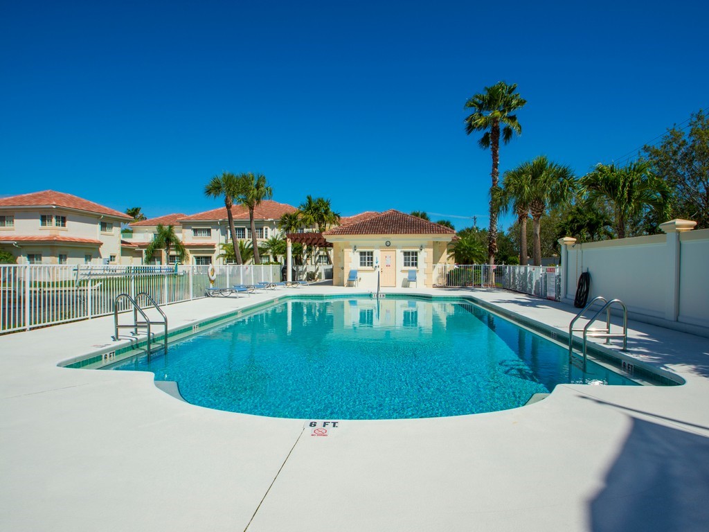 528 7th Square Southwest, Unit 102 Vero Beach, FL 32962 - Photo 21 of 28 a view of a house with a swimming pool