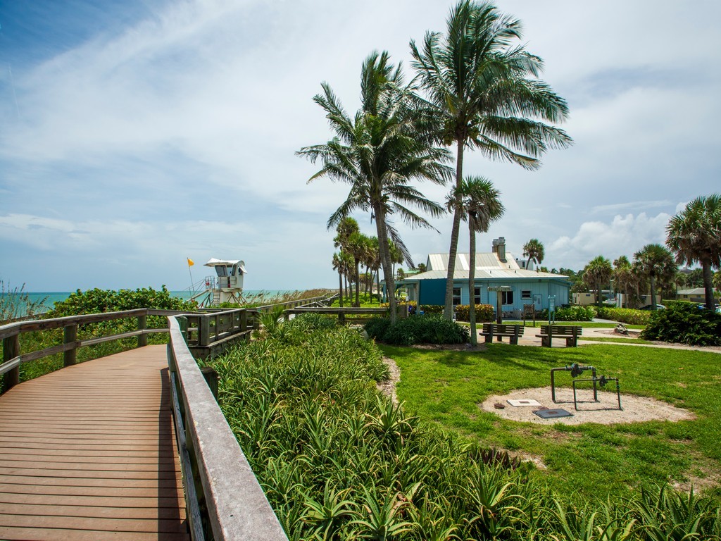 528 7th Square Southwest, Unit 102 Vero Beach, FL 32962 - Photo 25 of 28 a view of a lake with a building in the background