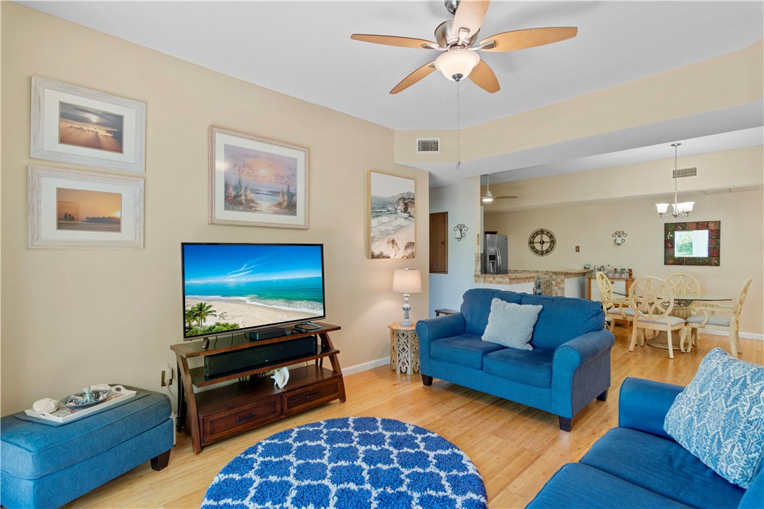 528 7th Square Southwest, Unit 102 Vero Beach, FL 32962 - Photo 9 of 28 a living room with furniture and a flat screen tv