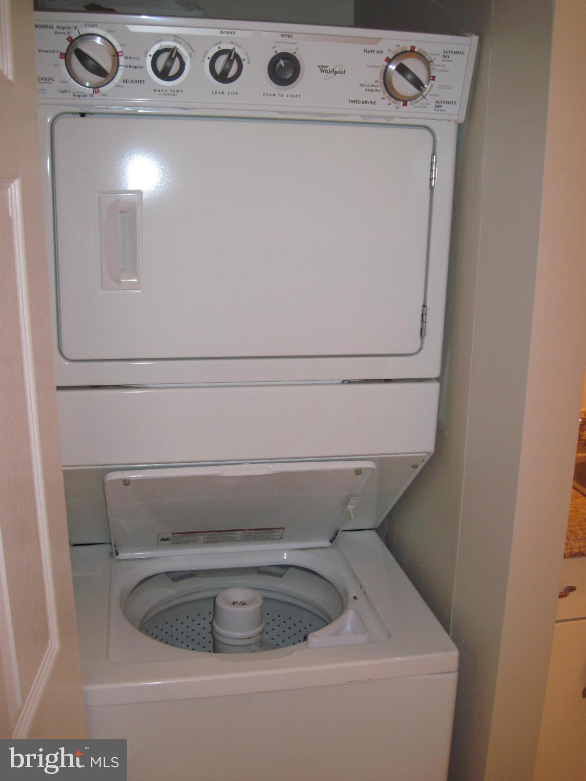 11200 Chestnut Grove Square, Unit 303 Reston, VA 20190 - Photo 13 of 30 a close up view of washer and dryer