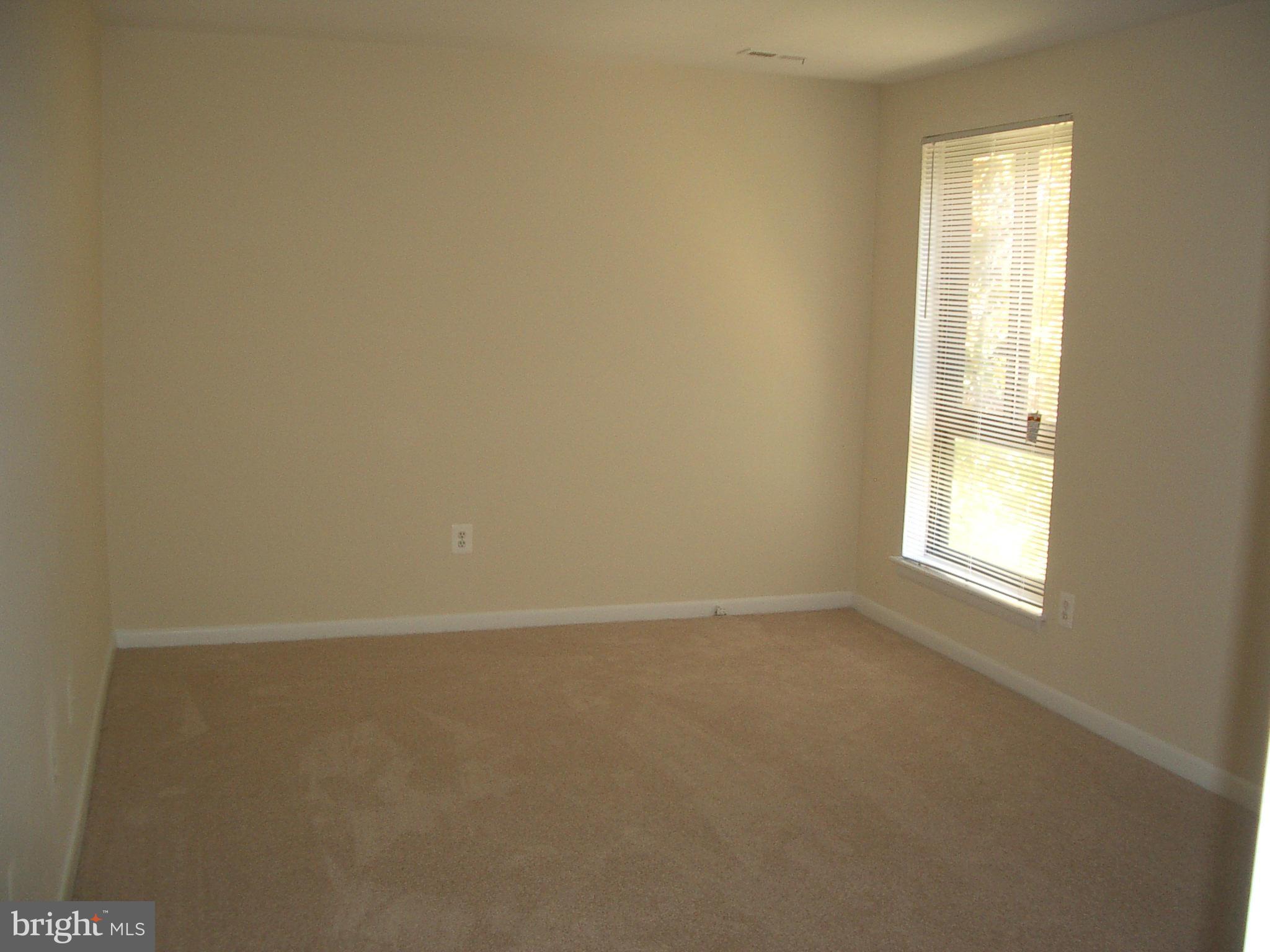 11200 Chestnut Grove Square, Unit 303 Reston, VA 20190 - Photo 16 of 30 an empty room with a window