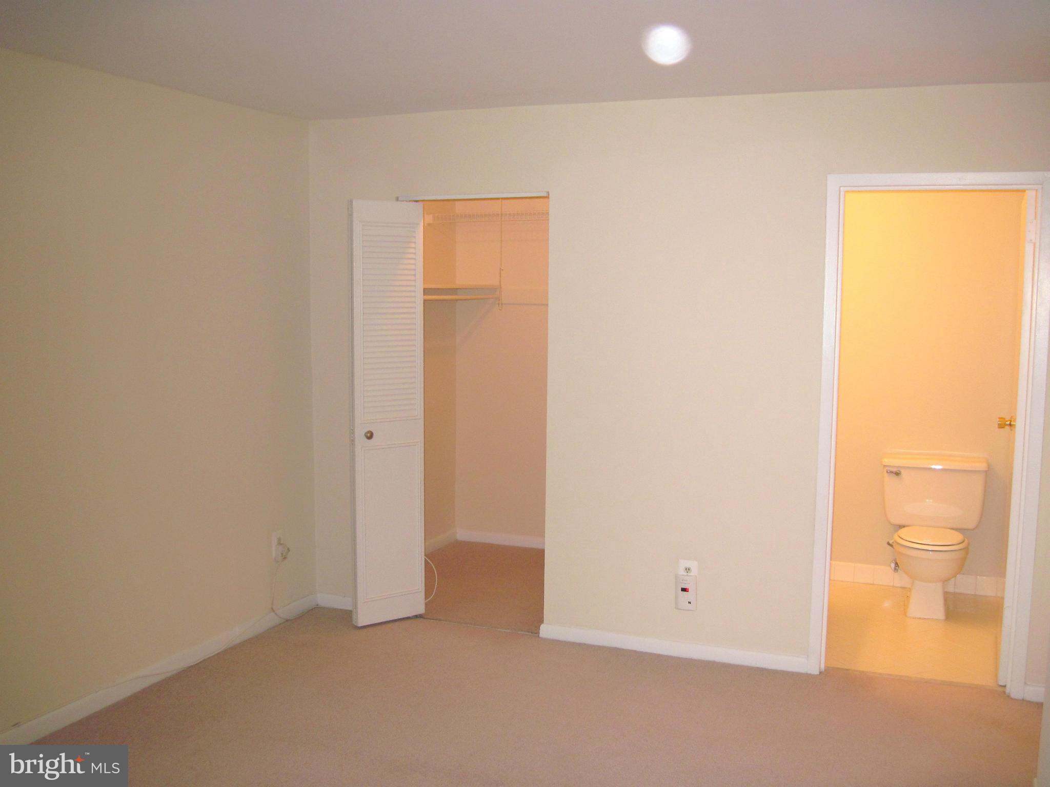 11200 Chestnut Grove Square, Unit 303 Reston, VA 20190 - Photo 17 of 30 a view of an empty room and a window