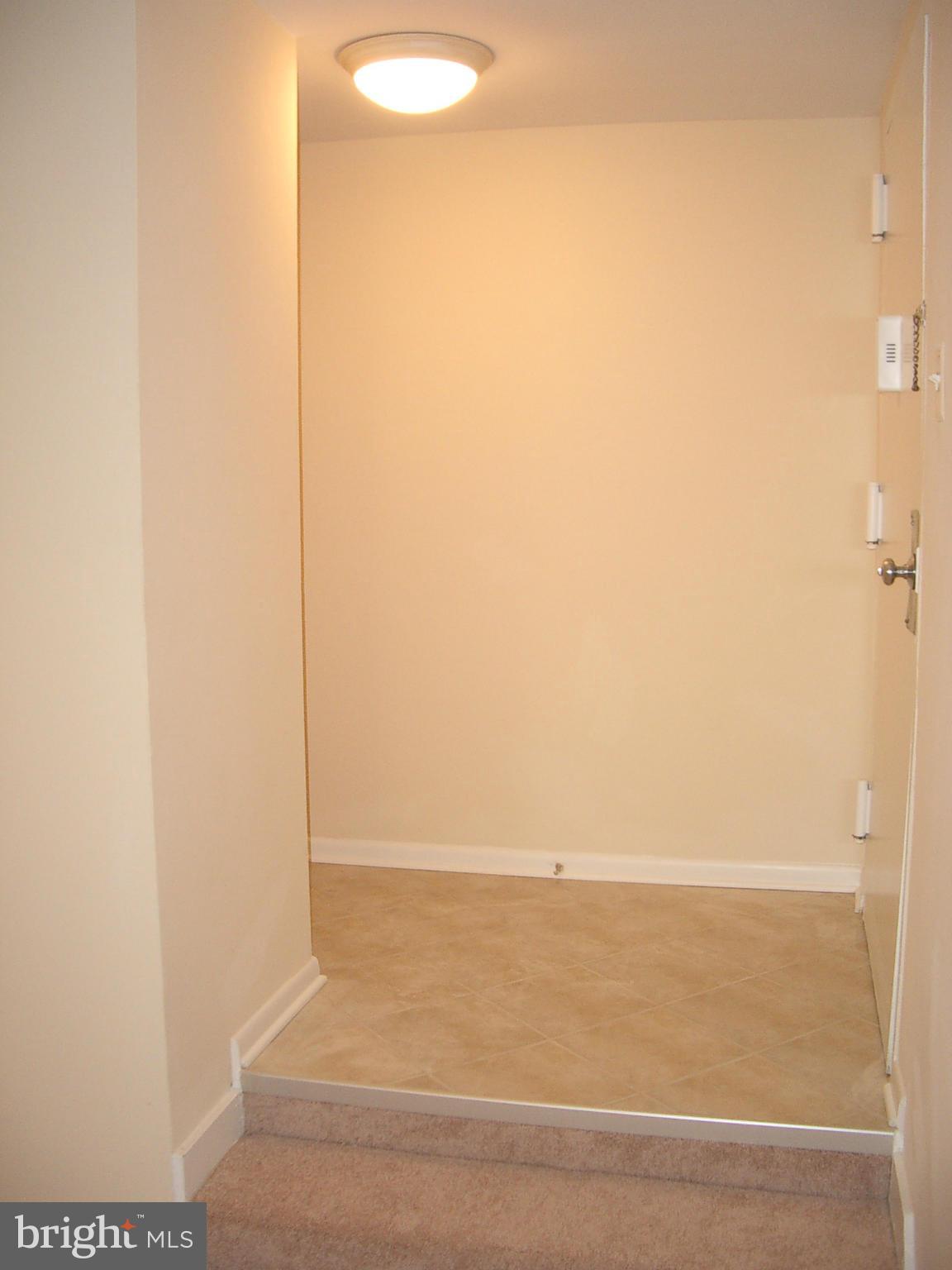 11200 Chestnut Grove Square, Unit 303 Reston, VA 20190 - Photo 2 of 30 a view of an empty room