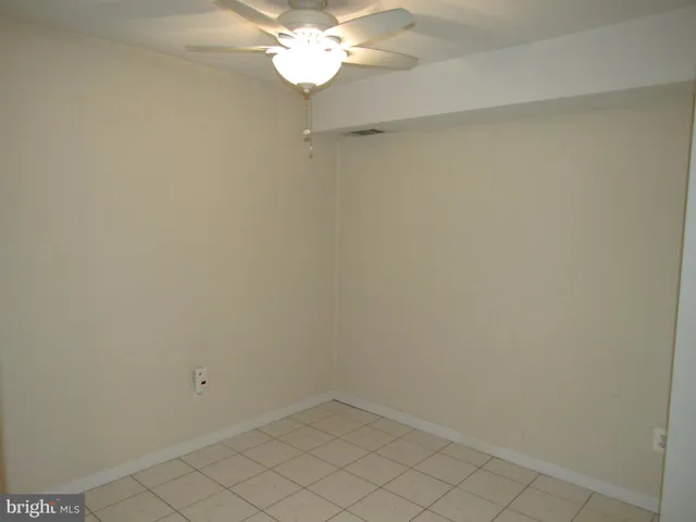 a view of a chandelier fan in a room