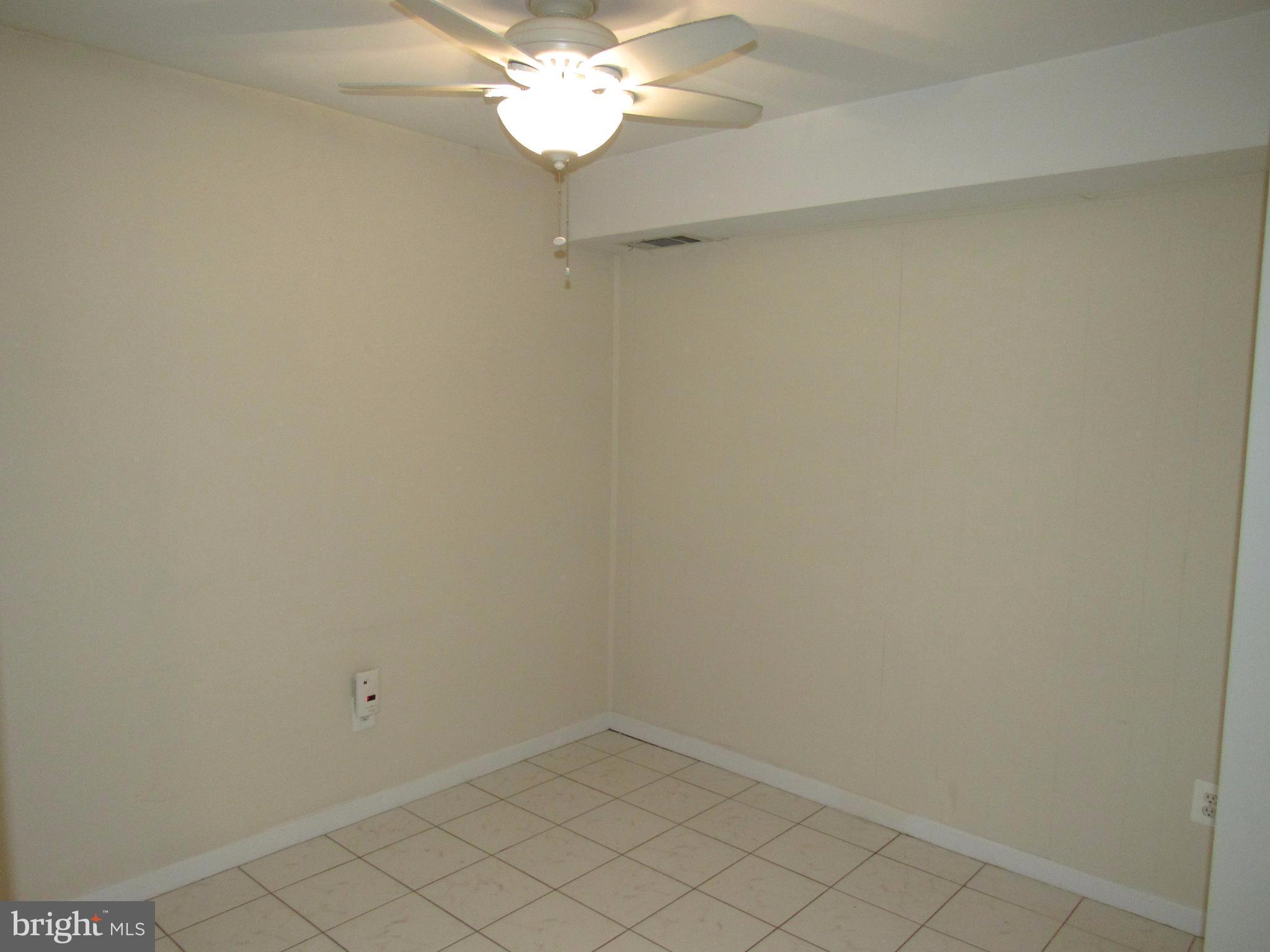 11200 Chestnut Grove Square, Unit 303 Reston, VA 20190 - Photo 10 of 30 a view of a chandelier fan in a room