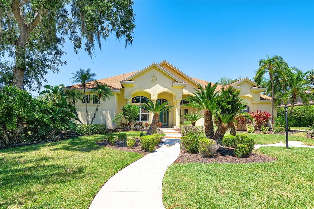 3011 Little Country Road Parrish, FL 34219 - Photo 1 of 1 a front view of a house with garden
