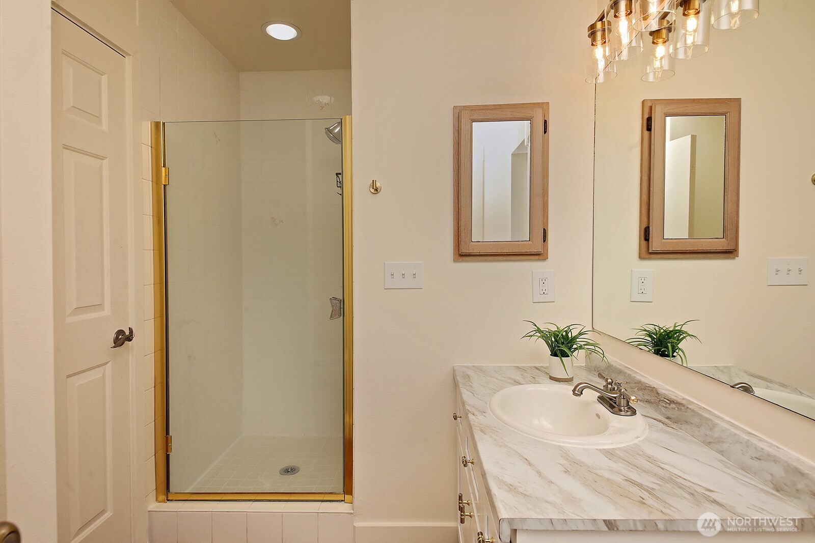 5663 Lenz Place Langley, WA 98260 - Photo 14 of 37 a bathroom with a sink and mirror