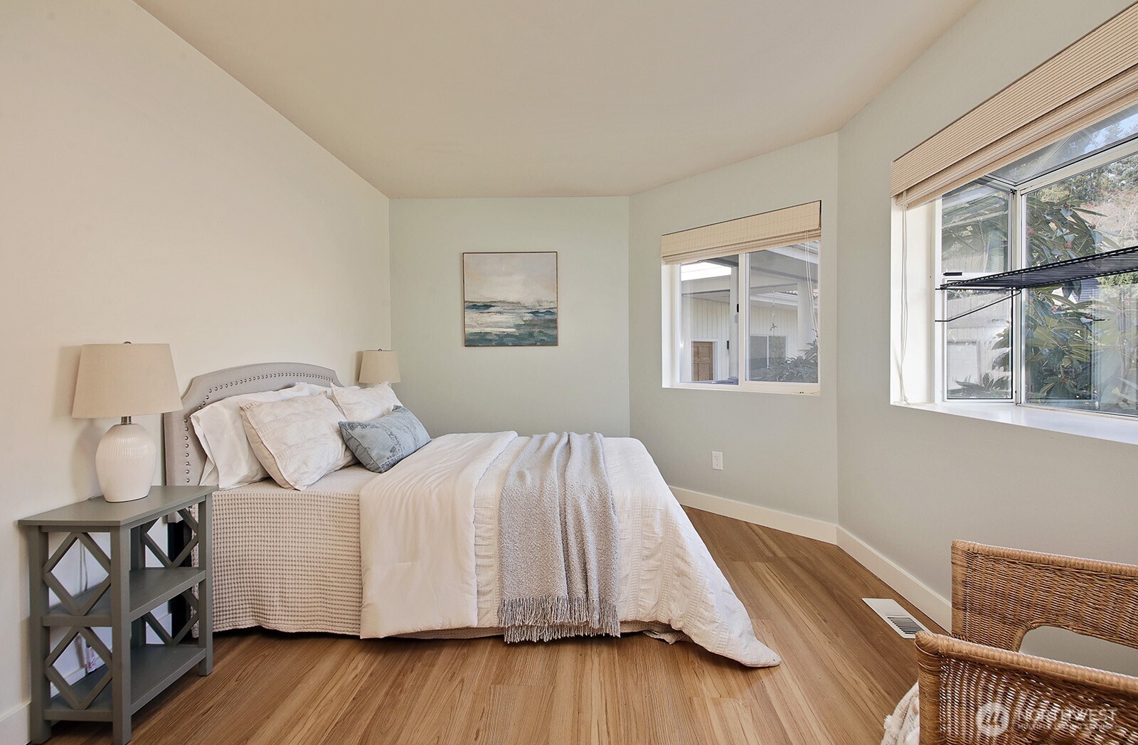 5663 Lenz Place Langley, WA 98260 - Photo 15 of 37 a bedroom with a bed and wooden floor