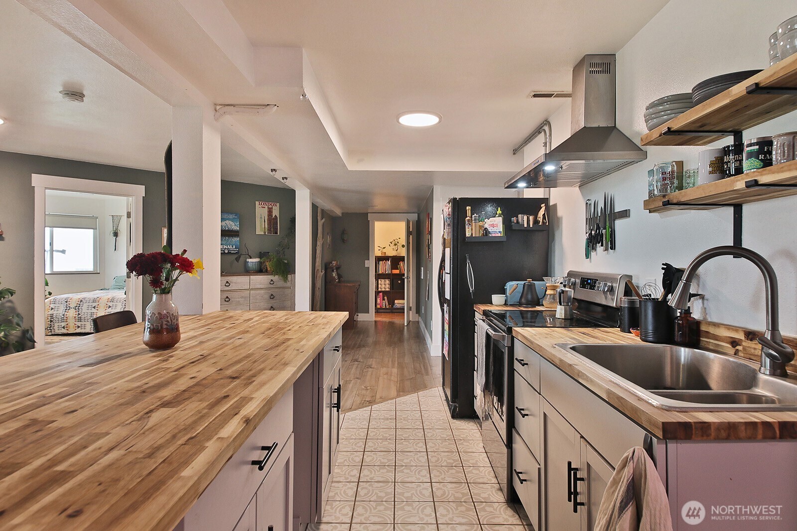 5663 Lenz Place Langley, WA 98260 - Photo 18 of 37 a kitchen with stainless steel appliances granite countertop a sink and cabinets