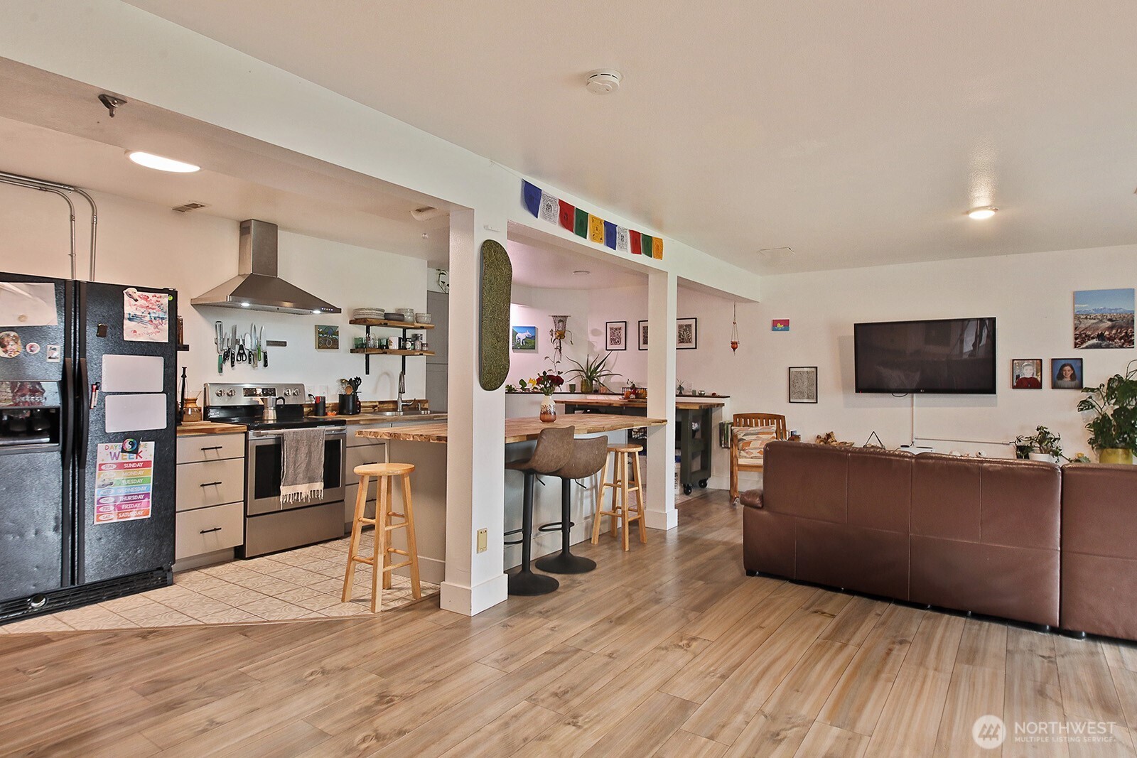 5663 Lenz Place Langley, WA 98260 - Photo 19 of 37 a living room with furniture and a flat screen tv
