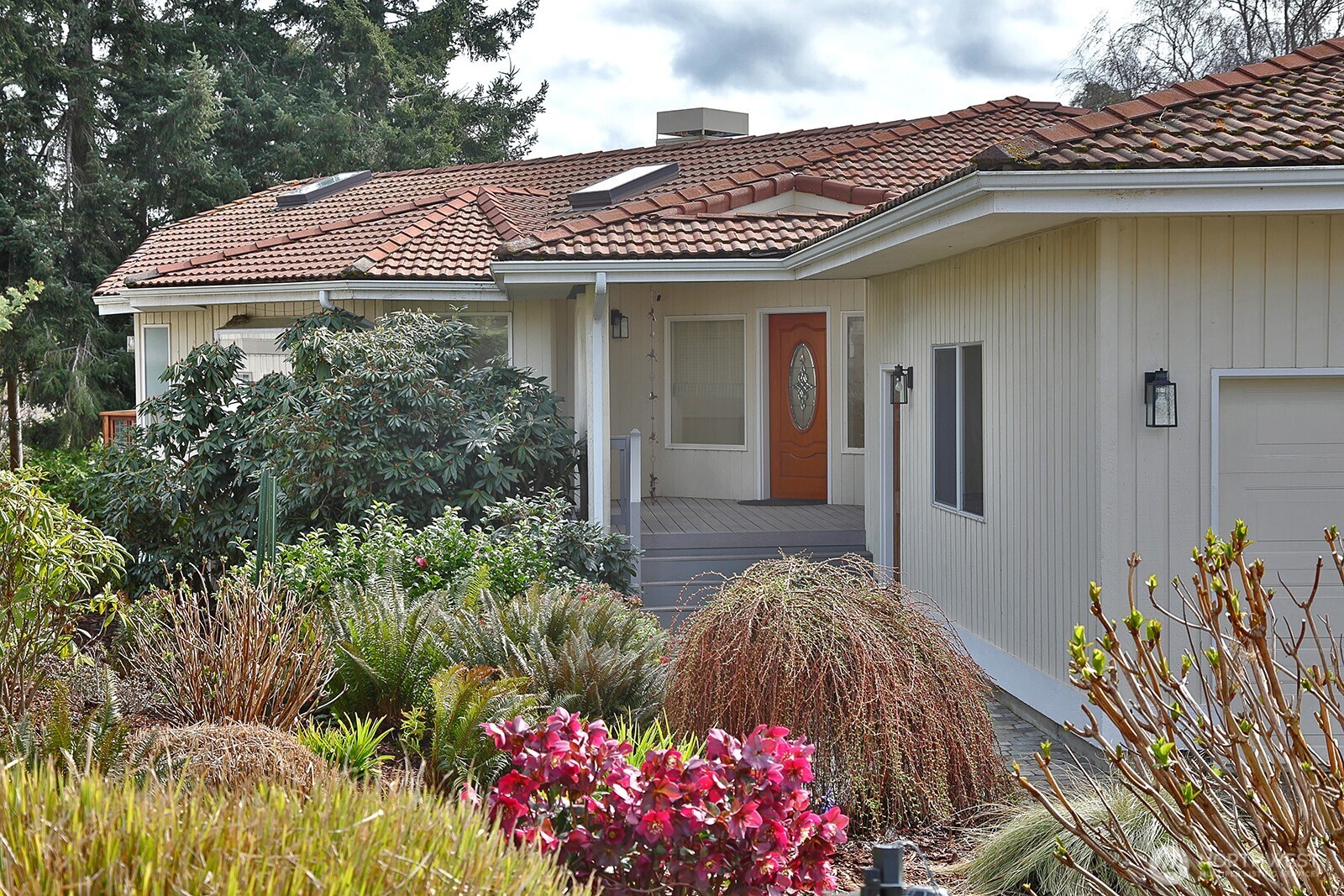 5663 Lenz Place Langley, WA 98260 - Photo 2 of 37 a view of a house with a lot of flower plants