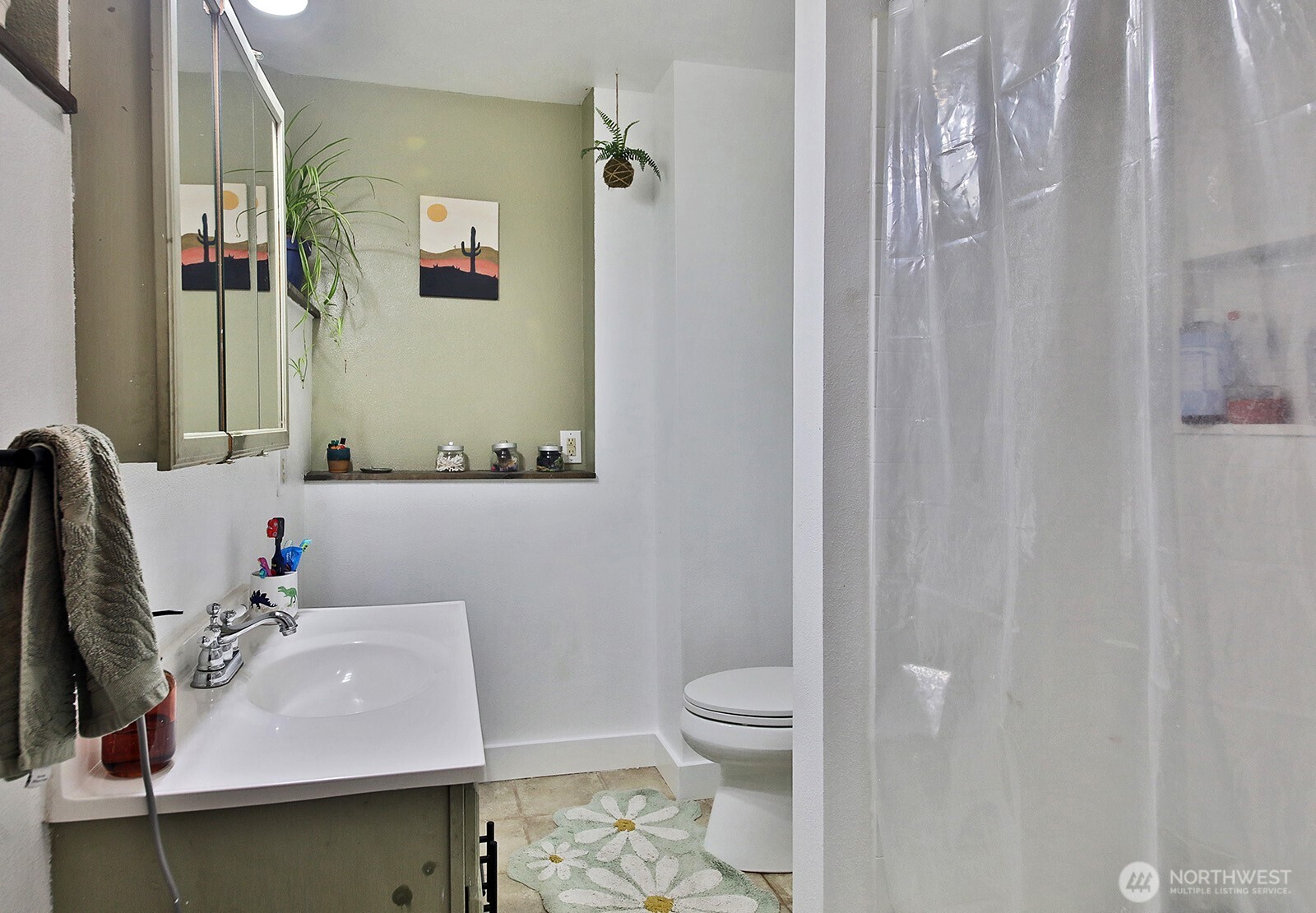 5663 Lenz Place Langley, WA 98260 - Photo 21 of 37 a bathroom with a sink toilet and mirror