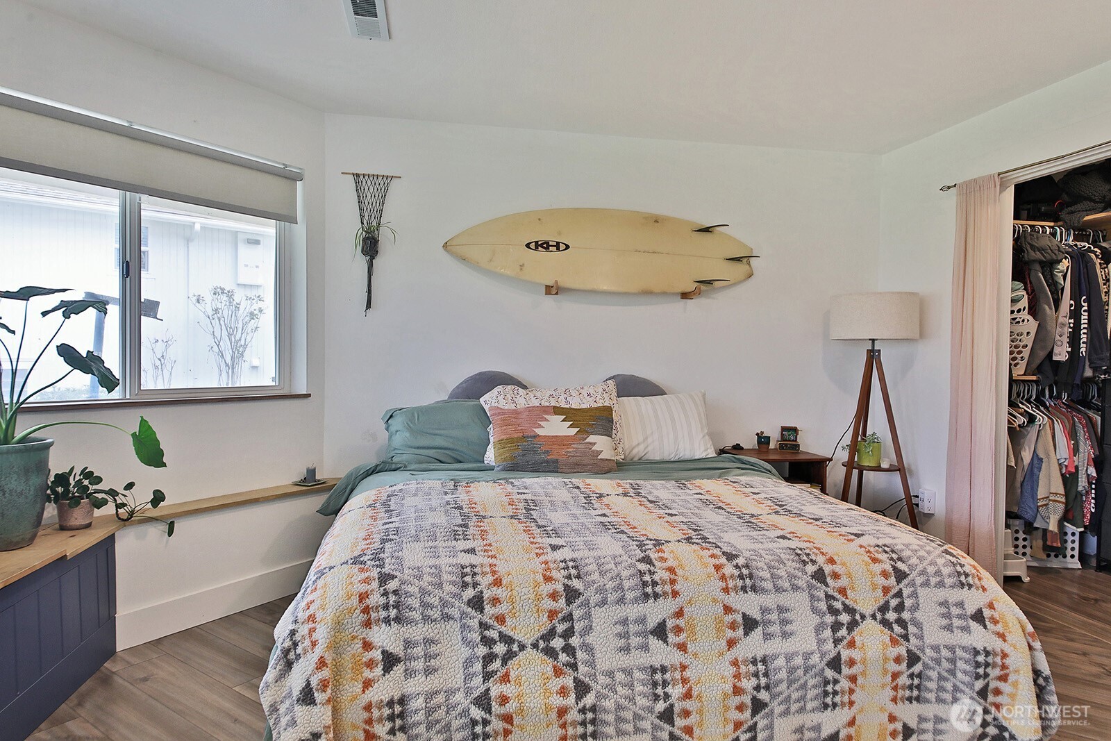 5663 Lenz Place Langley, WA 98260 - Photo 22 of 37 a bedroom with a bed and a chandelier