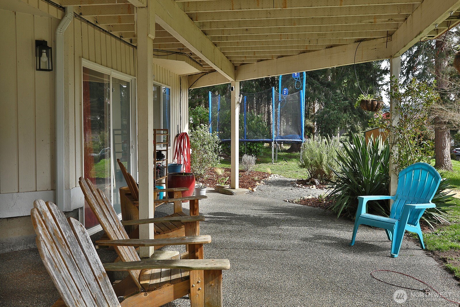 5663 Lenz Place Langley, WA 98260 - Photo 26 of 37 a view of patio with a table and chairs and potted plants