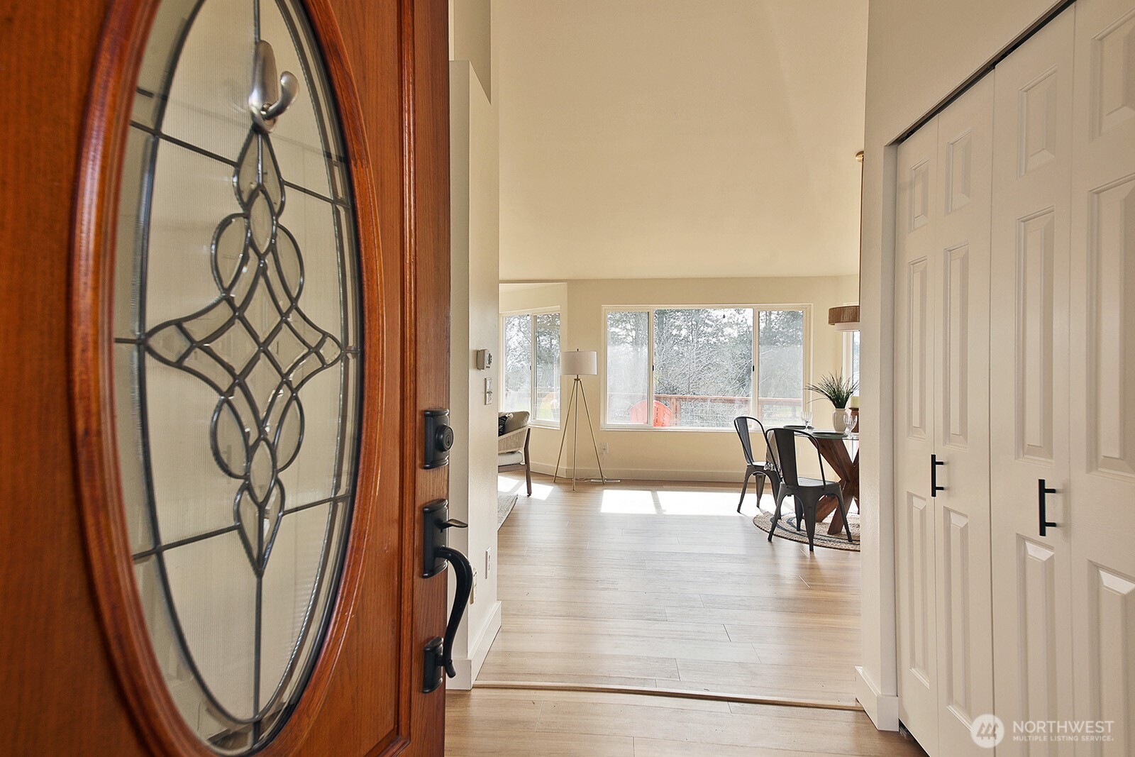 5663 Lenz Place Langley, WA 98260 - Photo 3 of 37 a view of a entryway with furniture and wooden floor
