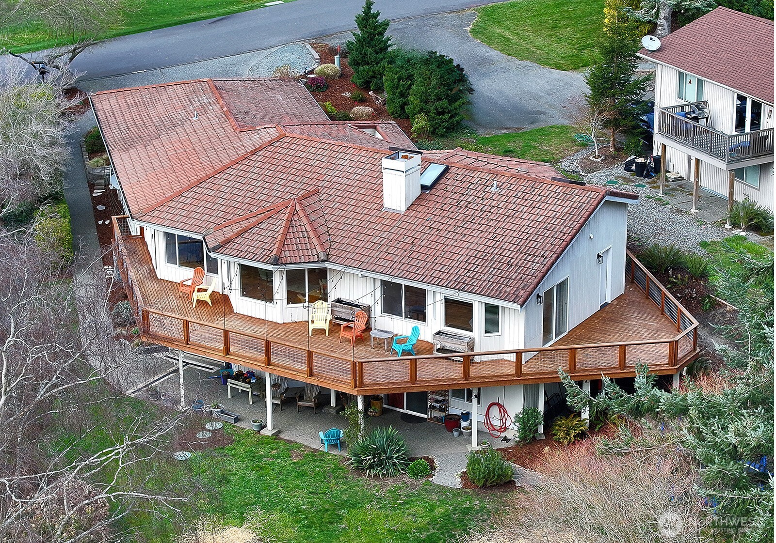 5663 Lenz Place Langley, WA 98260 - Photo 33 of 37 an aerial view of a house with table and chairs under an umbrella