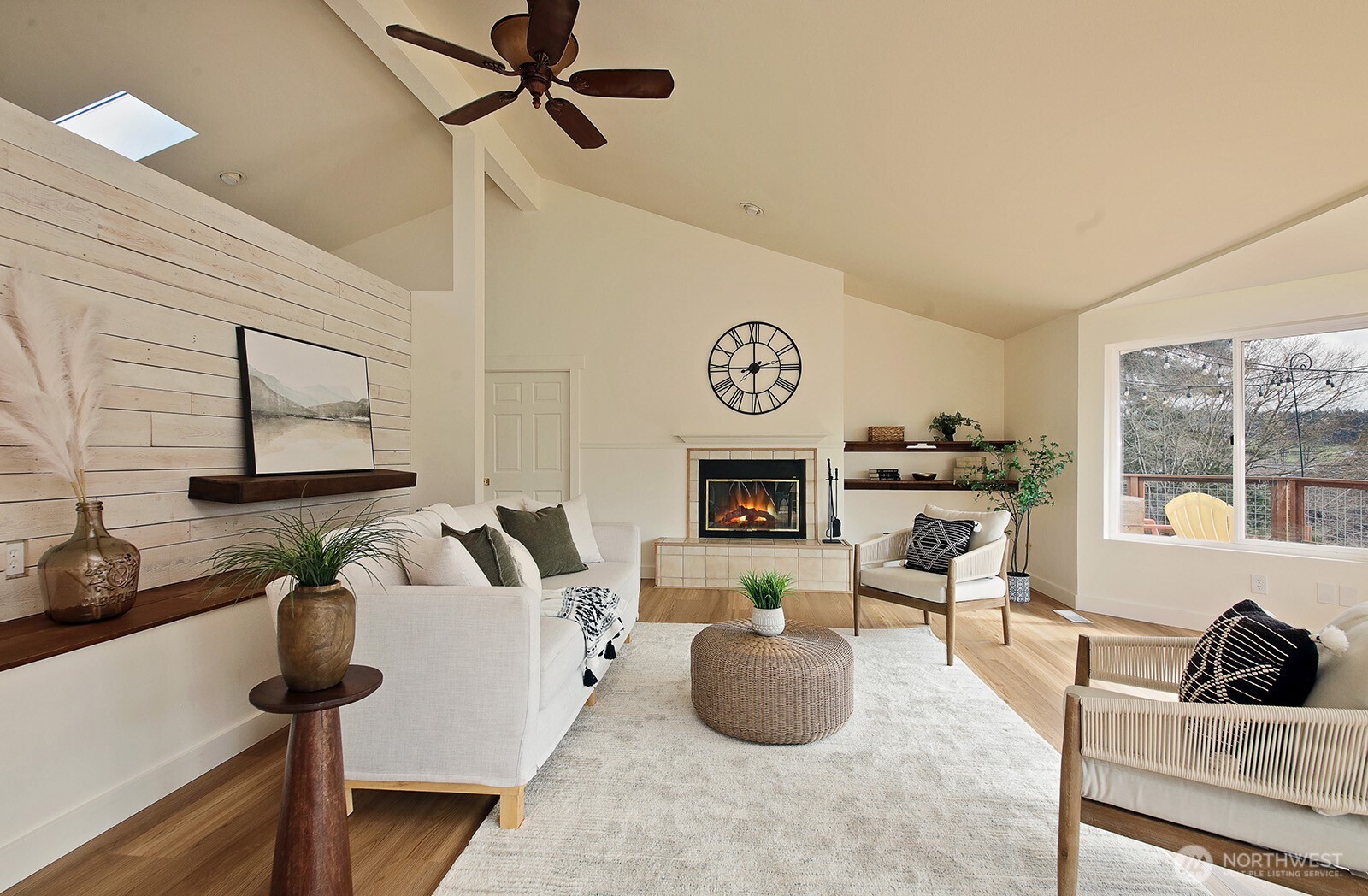 5663 Lenz Place Langley, WA 98260 - Photo 4 of 37 a living room with furniture a flat screen tv and a window