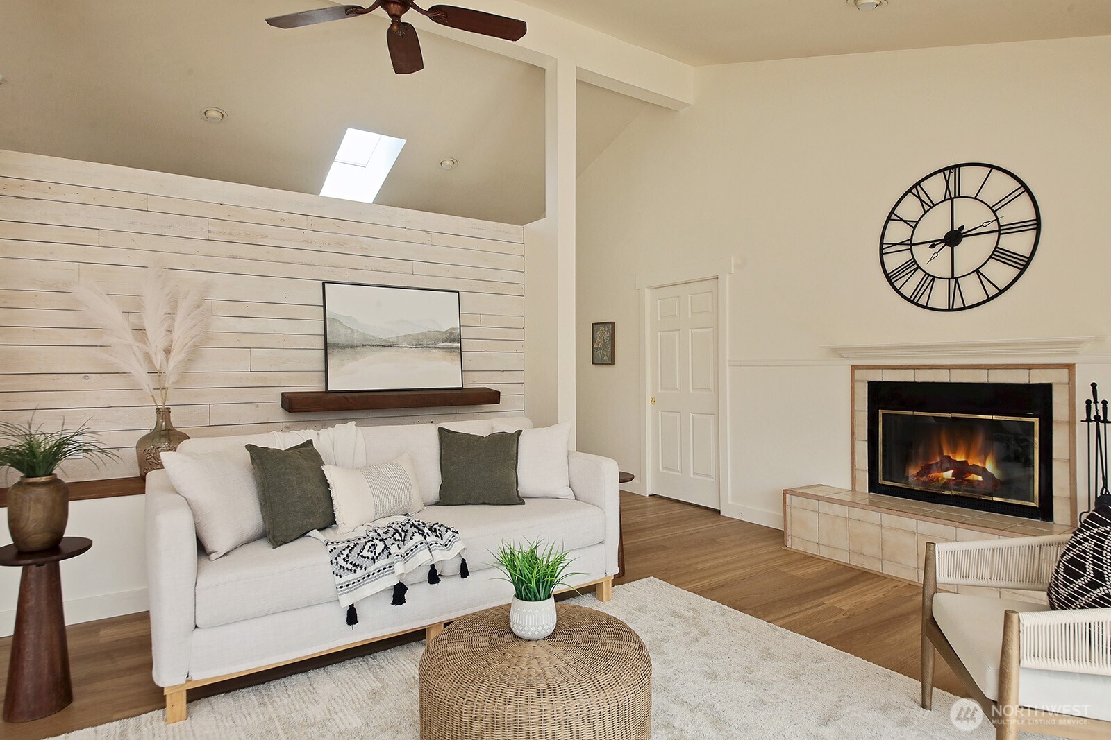 5663 Lenz Place Langley, WA 98260 - Photo 5 of 37 a living room with furniture a fireplace and a table