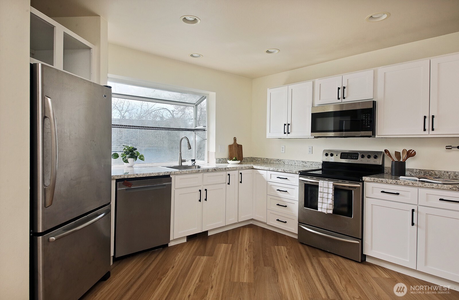 5663 Lenz Place Langley, WA 98260 - Photo 10 of 37 a kitchen with a refrigerator stove and sink