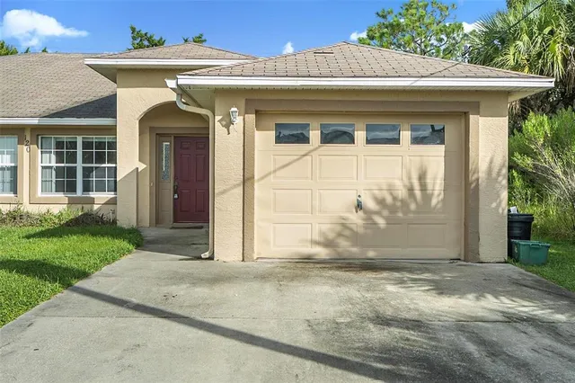 a view of a house with a small yard