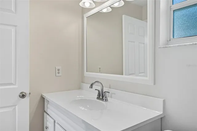 a view of a kitchen with wooden floor and a kitchen