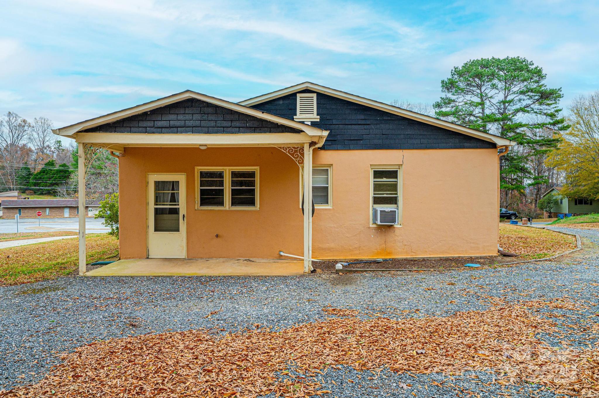 4823 Calico Road Lenoir, NC 28645 - Photo 11 of 31 a front view of a house with garden
