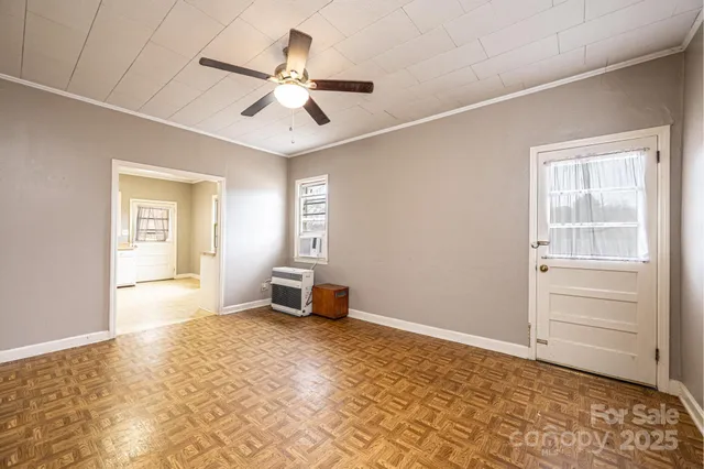 a view of an empty room with a window