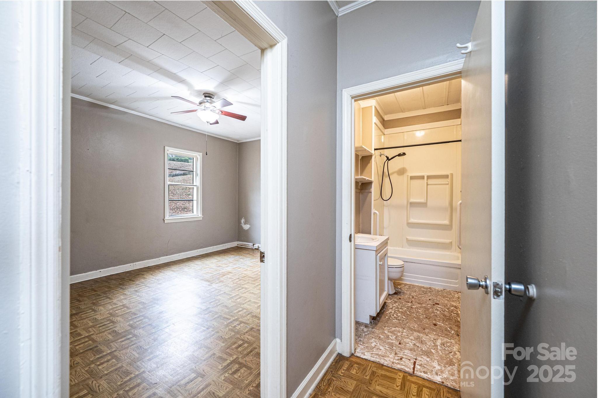 4823 Calico Road Lenoir, NC 28645 - Photo 28 of 31 a view of a hallway view with wooden floor and a bathroom