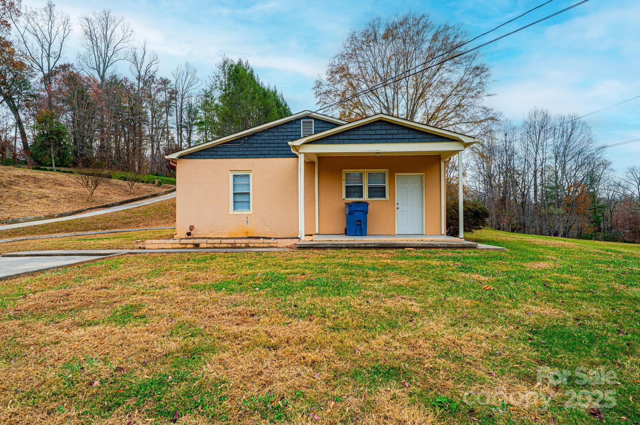 4823 Calico Road Lenoir, NC 28645 - Photo 4 of 31 a view of a house with a yard