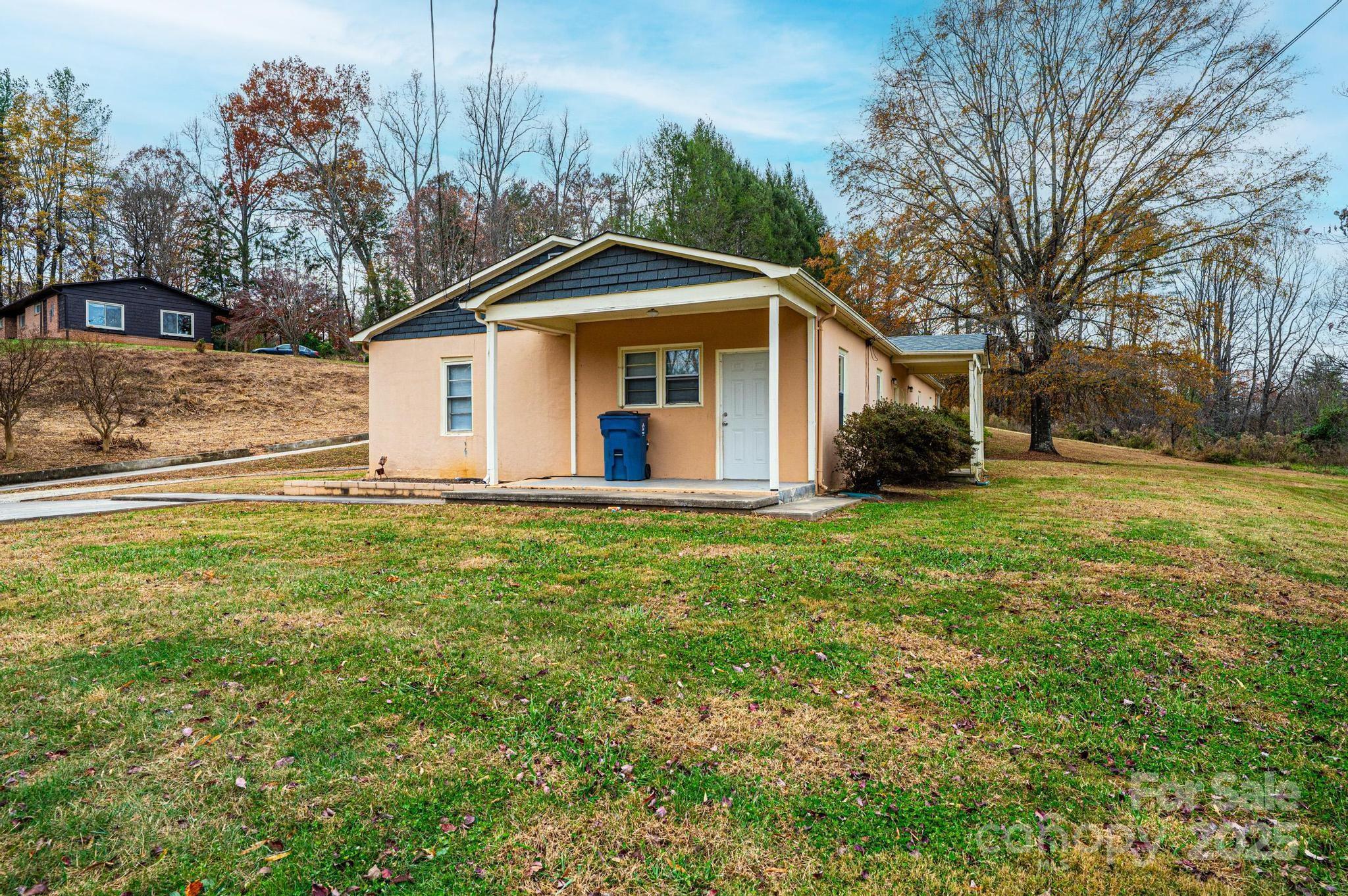 4823 Calico Road Lenoir, NC 28645 - Photo 5 of 31 a front view of house with yard and green space