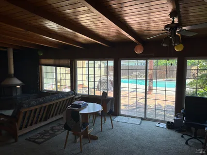 a table room with furniture and window