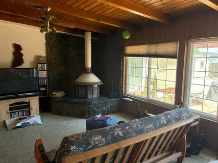 a kitchen with stainless steel appliances granite countertop a sink a stove and a refrigerator