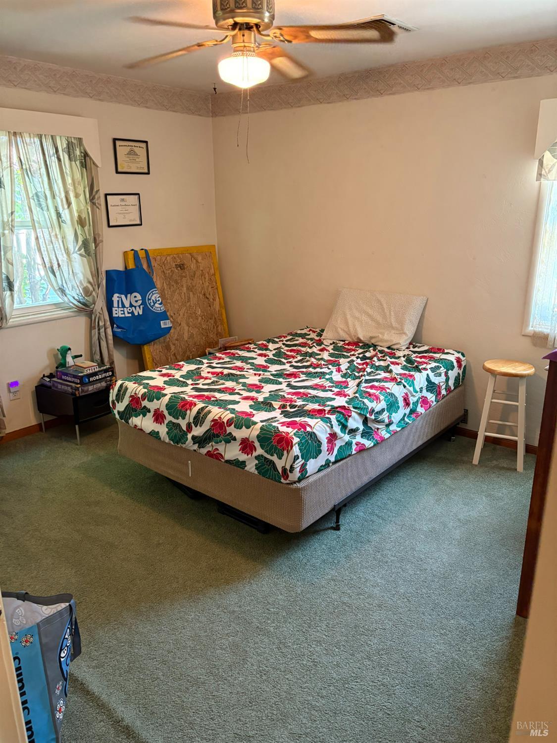 740 Linda Vista Way Rio Vista, CA 94571 - Photo 21 of 29 a bedroom with a bed and a chandelier