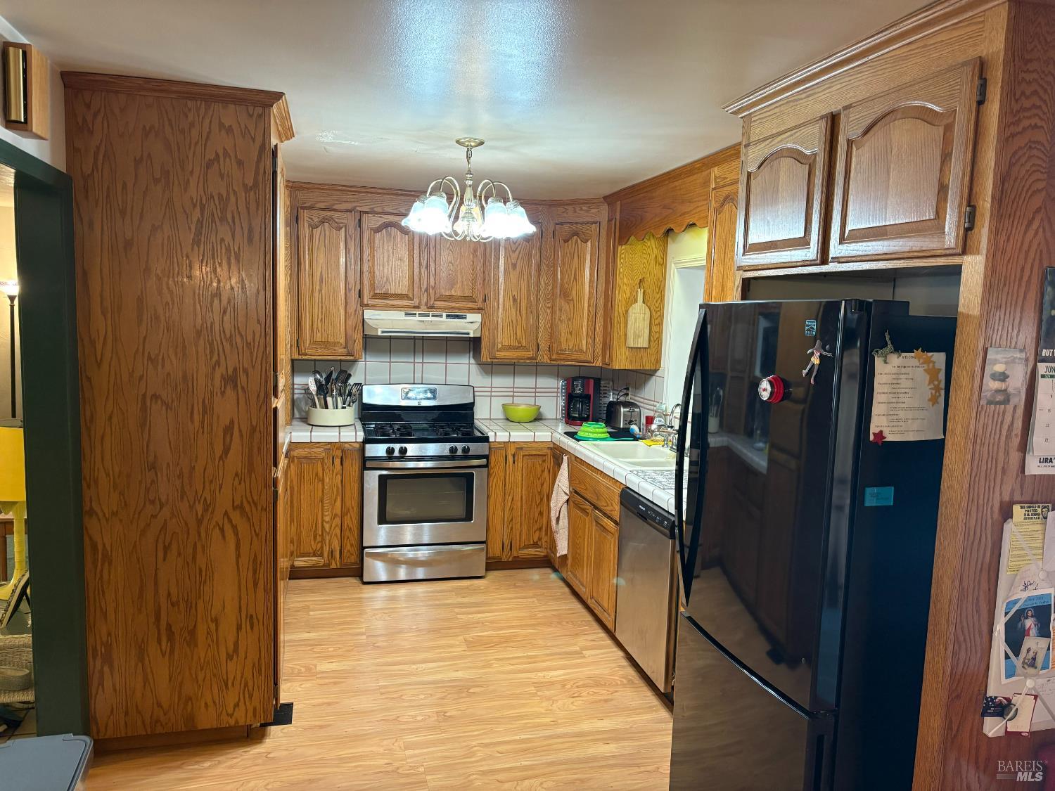 740 Linda Vista Way Rio Vista, CA 94571 - Photo 3 of 29 a kitchen with stainless steel appliances granite countertop a refrigerator a stove and a sink